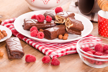 Chocolate rolls with hazelnuts and raspberries. 
