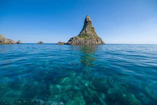 "Faraglioni" the famous cyclops island in Acitrezza, Sicily