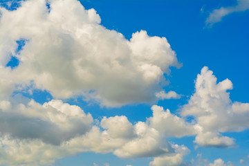 Naklejka na ściany i meble Beautiful soft clouds on blue sky background.