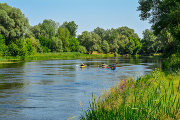 Ukraine, the river Seversky Donets, tourists swim in a kayak.