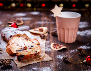 Christmas or New Year pastries Holidays Concept Dresdnen Stollen is a Traditional German Cake Gift Fruit Cake for the Holiday European festive dessert Tradition of Decoration Background