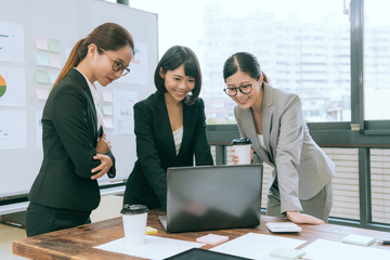 pretty office workers having teamwork meeting