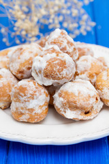 portuguese sweets cavacas on white plate on wooden background