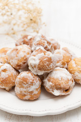 portuguese sweets cavacas on white plate on wooden background
