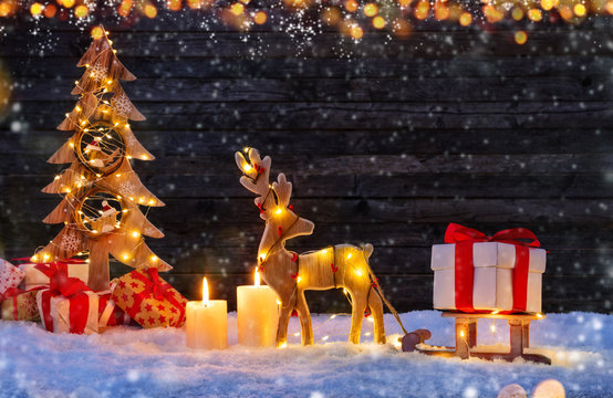 Christmas background with illuminated moose and christmas tree.