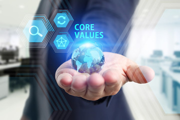 The concept of business, technology, the Internet and the network. A young entrepreneur working on a virtual screen of the future and sees the inscription: Core values