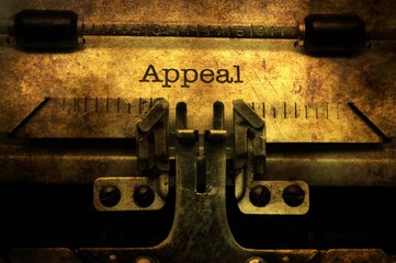 Appeal text on vintage typewriter