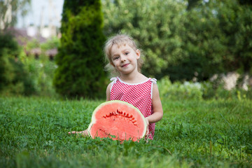 Funny little girl with watermelon slice