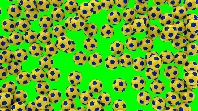 Animated a lot of simple soccer balls with plain yellow and black material falling and tumbling filling up container against green background. Top view shot.