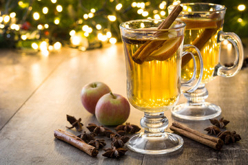  Mulled cider in glass on wooden table.Copyspace
