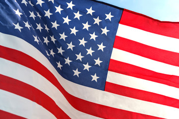 Waving star and stripes American flag on white background