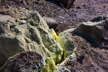 Sulfur haze and crystals on the rocks. Volcano or Vulcano Island in the archipelago of Aeolian Islands close to Sicily - Italy.