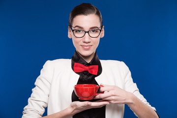 brunette in glasses with a cup in his hands