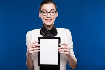 young girl in glasses with the tablet