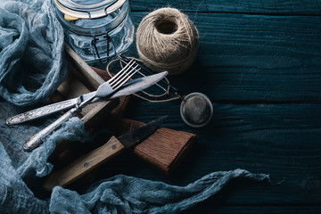 Preparation for cooking. Old cutlery. On a wooden background. Top view. Free space for your text.