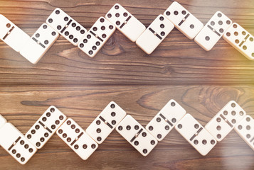 Dominoes on a wooden background