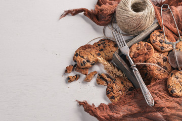 Cookies with chocolate. On a wooden background. Top view. Free space for your text.