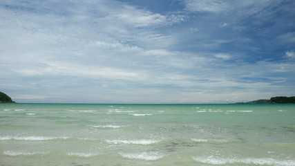 sea beach with blue sky and clouds