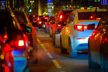 Traffic jam at the city centre back view at the night