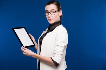 close-up portrait of a girl with a tablet in hands