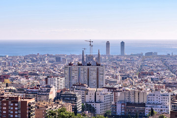 Fototapeta premium Barcelona city View from Park Guell at sunrise. Beautiful blue sky