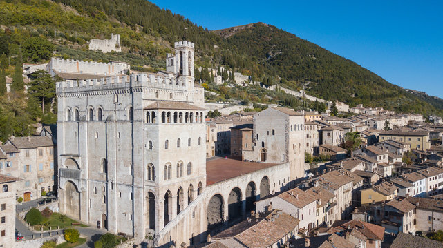 Gubbio, Italy. One of the most beautiful small town in Italy. Drone aerial view of the city center, main square and the historical building called Palazzo dei Consoli
