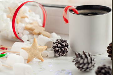 Fototapeta na wymiar new year coffee break with festive sweetness cookies