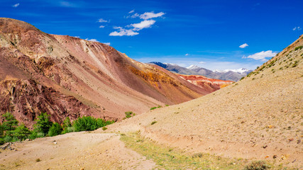 Fototapeta na wymiar Kyzyl-Chin Valley (other name is Mars), is a picturesque desert terrain in the Altai Mountains, Russia. It is formed with multi-colored clays, composing the fantastic Martian lanscape.