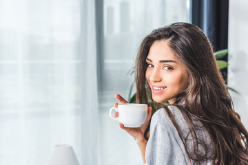 girl drinking coffee at home