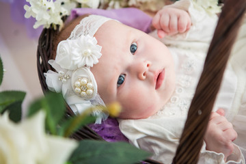Fototapeta na wymiar Little baby girl in a beautiful dress