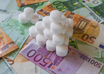Salt pellets for the water softener on the background of Euro banknotes