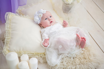 Little baby girl in a beautiful dress