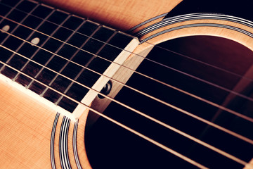Obraz premium Close Up shot photo of Classic acoustic guitar with filter effect retro vintage style