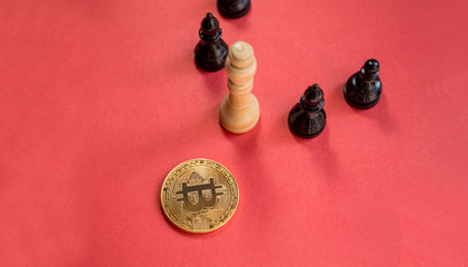 Obraz na płótnie Canvas chess figures and golden bitcoin