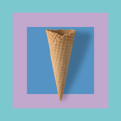 Ice cream cone on pastel colorful background. Minimal summer concept.