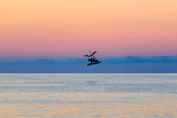 Fototapeta premium Flying airplane over the Black sea