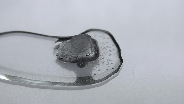 The ice is melting. Time lapse video of melting snow. An interesting abstraction.