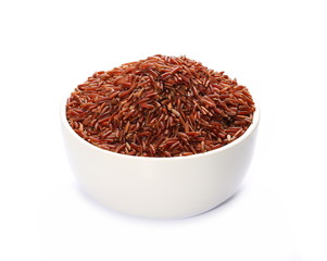 Red wild rice pile in porcelain bowl isolated on white background