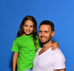 Fototapeta premium Father and child with happy faces. Man and girl hug