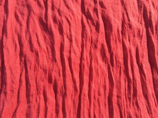 Detail of a red scarf background