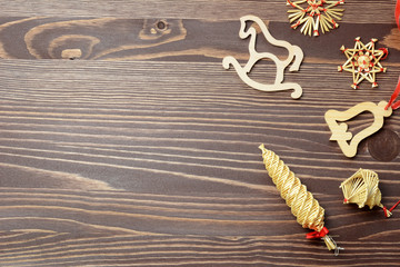 Christmas gift box, food decor and christmas decorations on a dark wooden background. Top view with copy space.