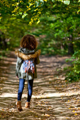 Teen girl in autumn forest