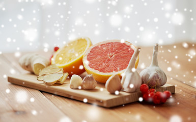 citrus, ginger, garlic and rowanberry on wood