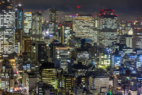 Downtown city buildings at night, Tokyo, Japan