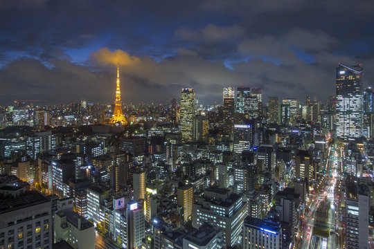 Elevated night view of the city skyline and iconic illuminated Tokyo Tower, Tokyo, Japan