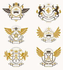 Obraz premium Vintage decorative heraldic vector emblems composed with elements like eagle wings, religious crosses, armory and medieval castles, animals. Collection of classy symbolic illustrations.
