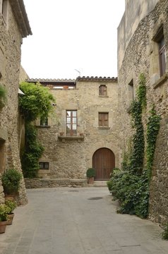 Cobblestone street in in Monells, Girona, Spain