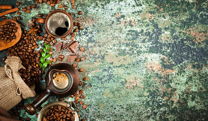 Fototapeta na wymiar Black coffee in a cup on the table in a composition with coffee accessories on an old background