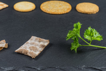 Dry cracker cookies with black background