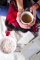 Woman in cozy home wear relaxing
